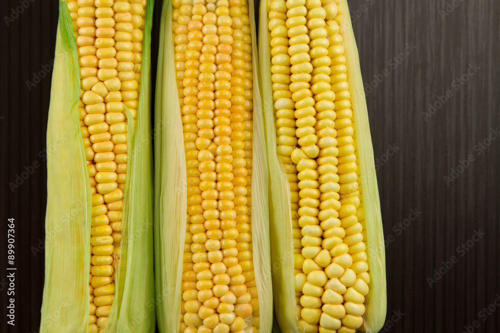 fresh ripe ears of corn on wooden background fresh ripe ears of corn on wooden background