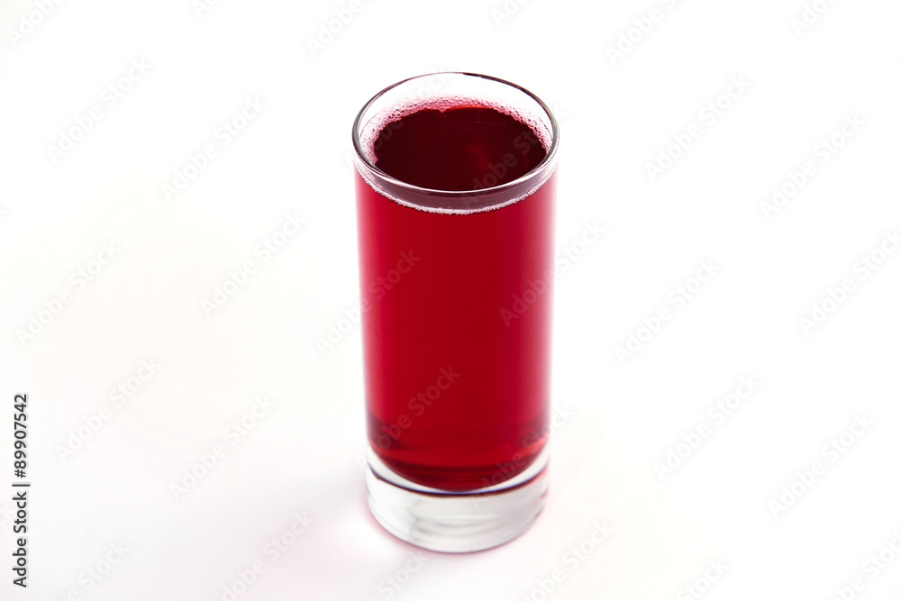 Obraz premium fresh cool red glass of cherry juice isolated at white background
