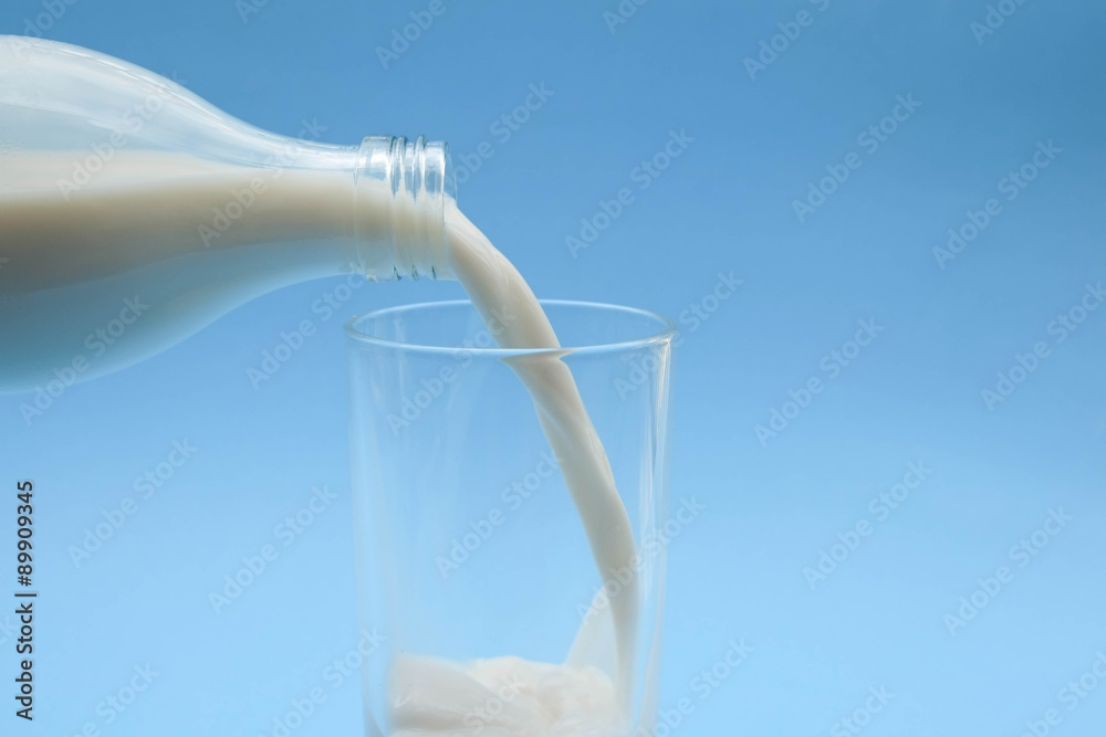with milk on blue background with milk on blue background
