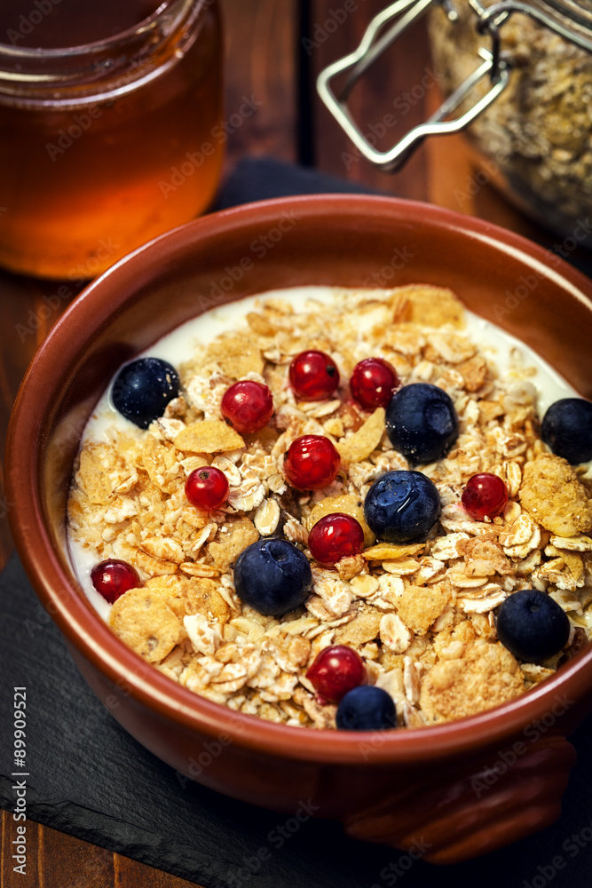 Healthy Breakfast Muesli with berries,honey and milk