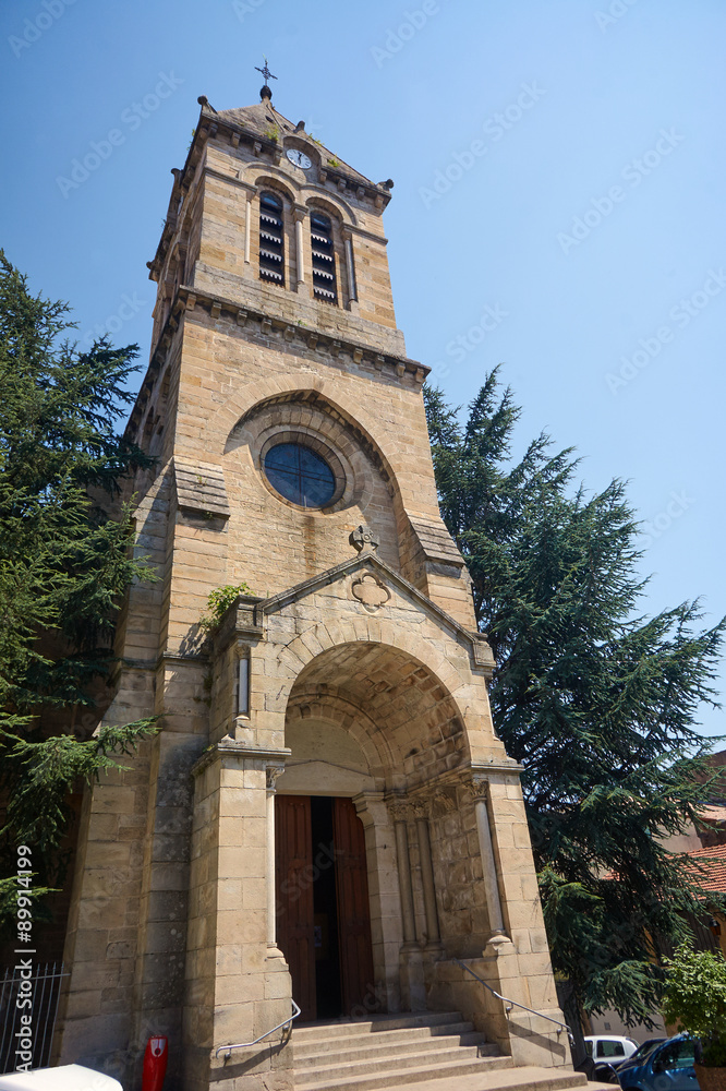 Tower and entrance to the church in the city Privas in France.