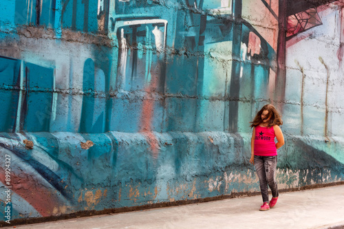 Portrait of a young girl on a urban street © victoriavader