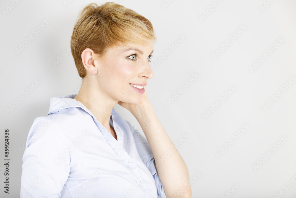 Woman in blue shirt in fashion pose Woman in blue shirt in fashion pose