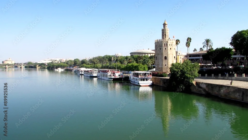 Panoramic view of the river Guadalquivir in which is the Torre del Oro in Seville, Spain Panoramic view of the river Guadalquivir in which is the Torre del Oro in Seville, Spain
