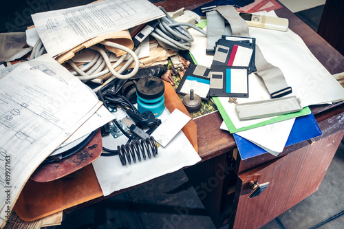 Fotografija Messy workplace with paper on table