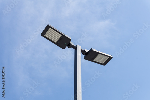 Modern street lighting against blue sky - bottom view - horizontal image