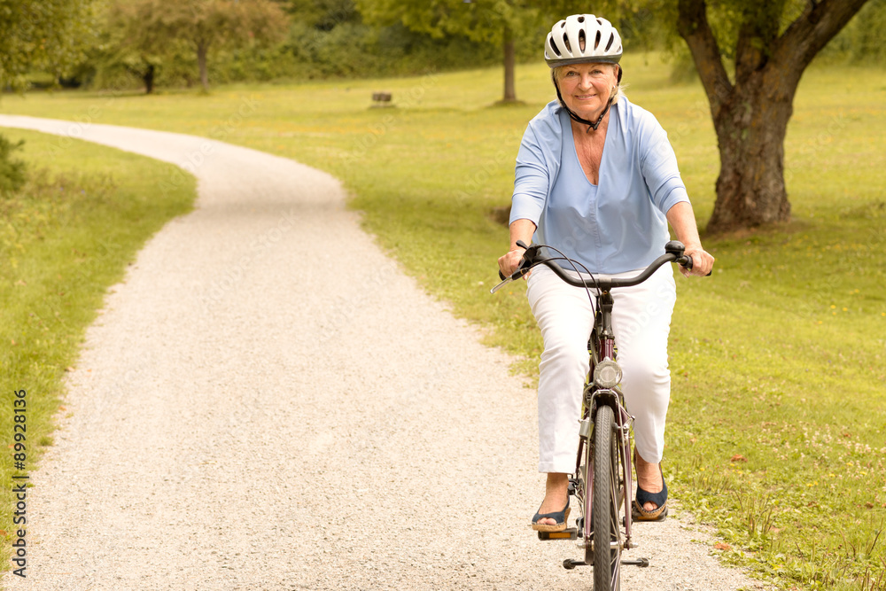 Fototapeta premium Fit healthy senior lady out cycling