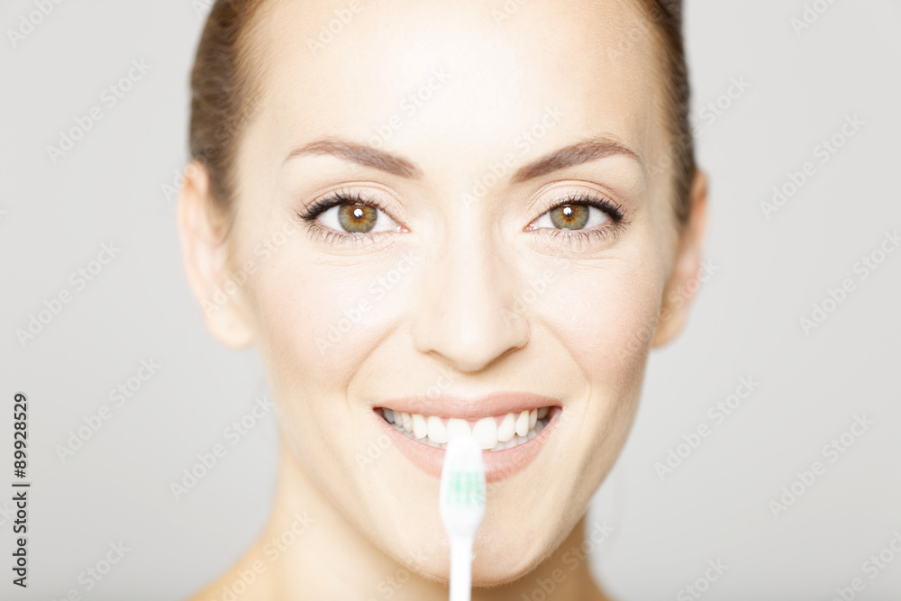 Beautiful woman holding a toothbrush Beautiful woman holding a toothbrush