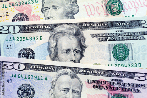 Fan of dollar bills in various denominations