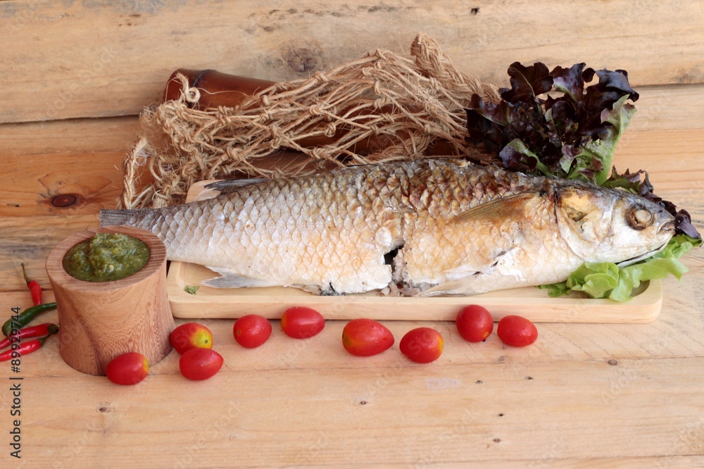 Grilled fish of salt with spicy sauce delicious. Grilled fish of salt with spicy sauce delicious.