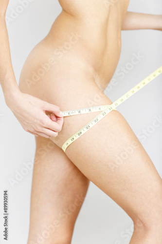 Woman using measuring tape