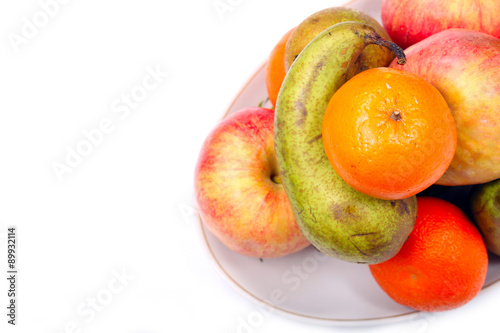 Still life of ripe fruit on a white background. Space for text