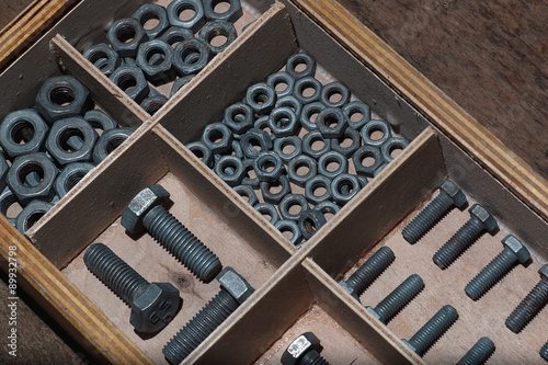 screws and bolts in a box