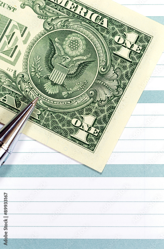 Empty lined paper to white a shopping list, money and pen Empty lined paper to white a shopping list, money and pen