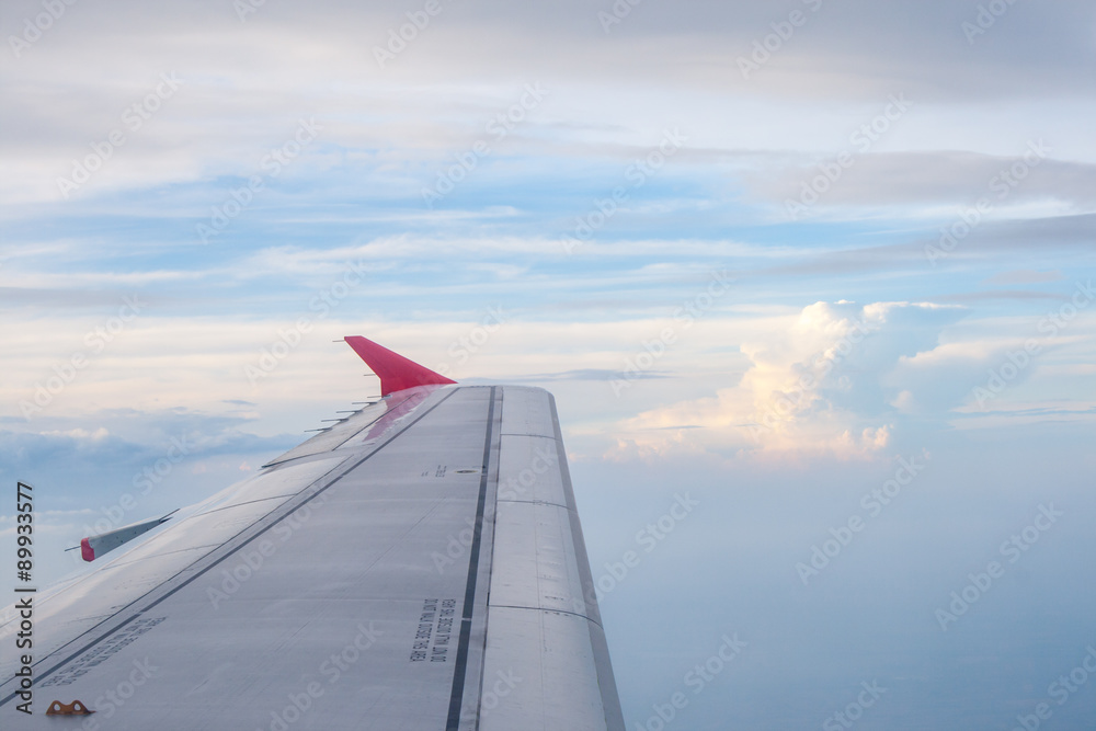 view from the plane on the wing and clouds view from the plane on the wing and clouds