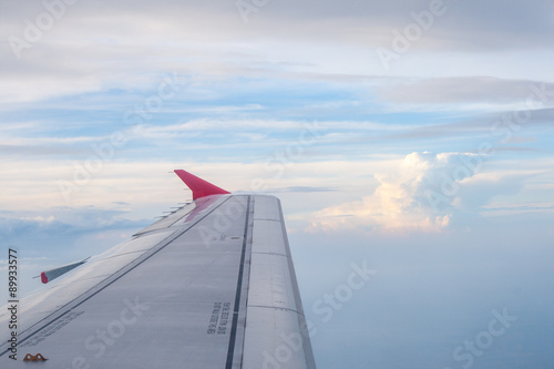view from the plane on the wing and clouds