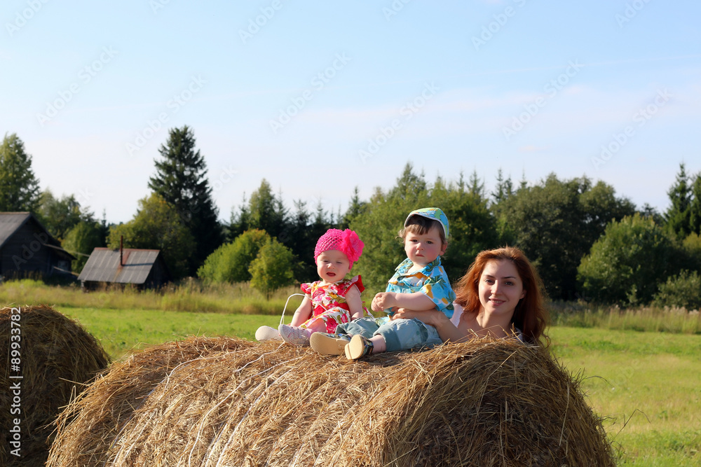 mother with twins in field mother with twins in field