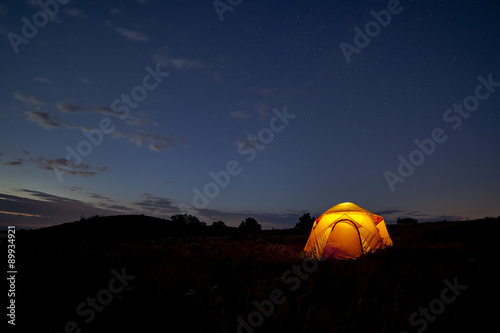 Starry Night/ A yellow tent glows against a starry sky in Shenandoah National Park, Virginia.