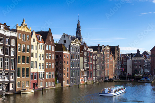 A view of the Damrak canal, near the Amsterdam Central Station, Netherlands