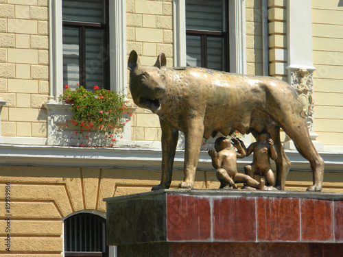 Close up of mother wolf with Remus and Romulus.