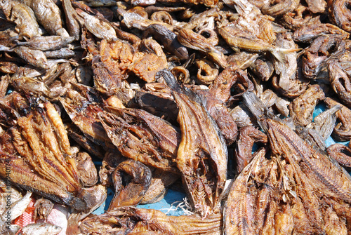 A seller of dried fish to the market of Pomerini, Tanzania, Afri photo