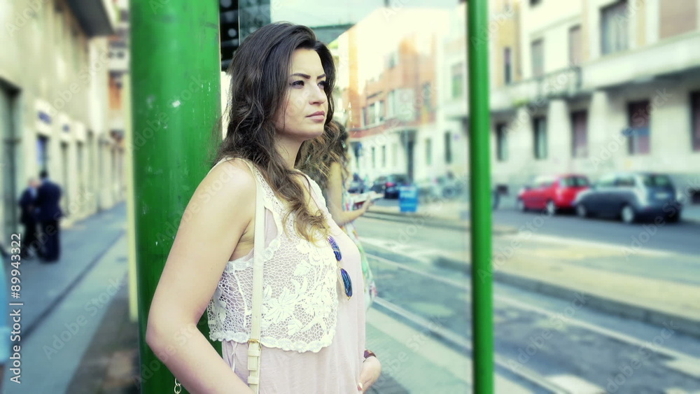 Woman standing on the tram stop, steadycam shot
Woman standing on the tram stop, steadycam shot