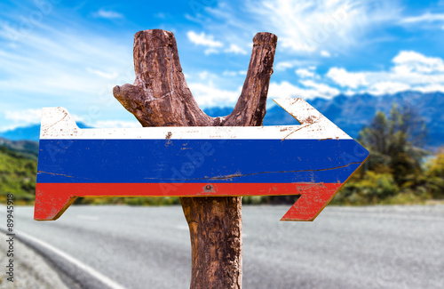 Russia Flag wooden sign with road background