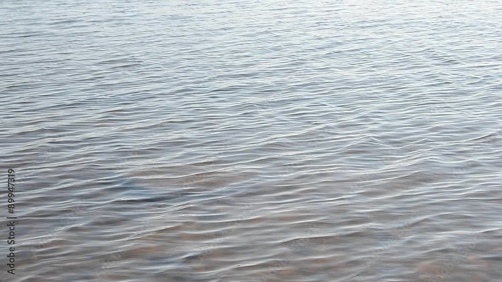 Waves on the water of the lake on a sunny day. Waves on the water of the lake on a sunny day.