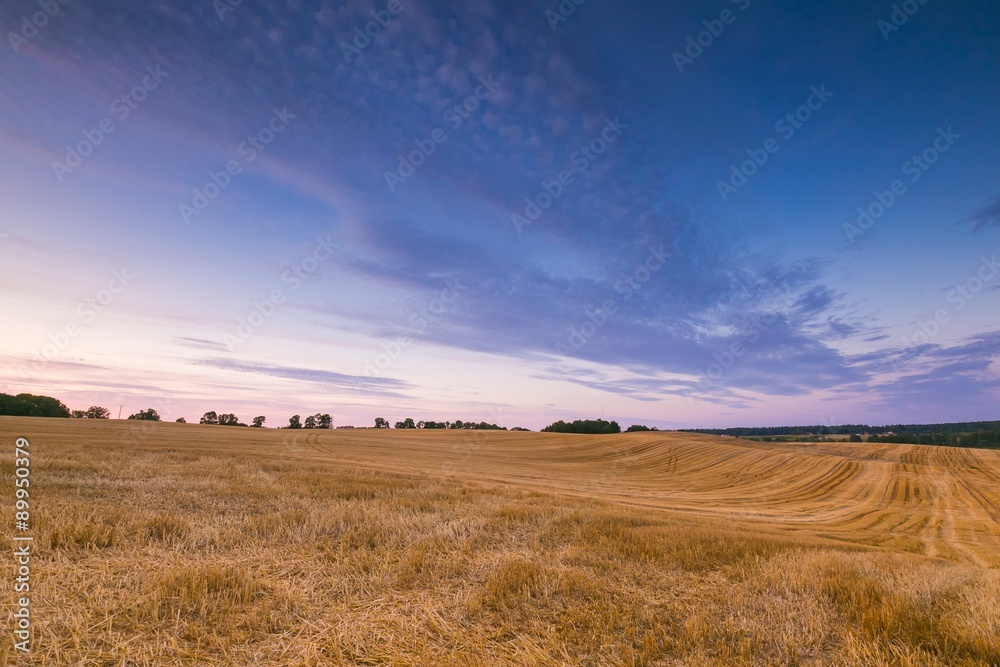 Beautiful sunset sky over calm countryside Beautiful sunset sky over calm countryside