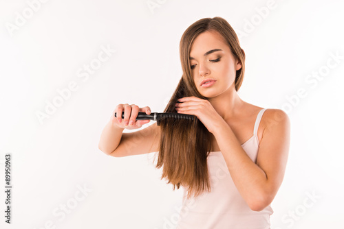 Girl combing her hair