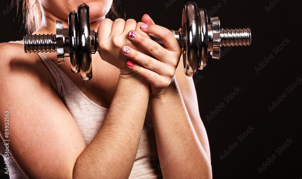 athletic woman working with heavy dumbbells athletic woman working with heavy dumbbells