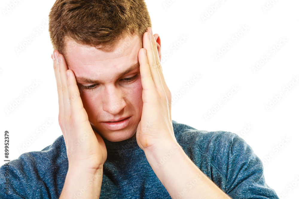 Closeup stressed man holds head with hands Closeup stressed man holds head with hands