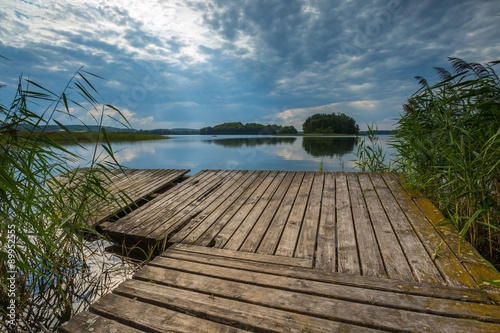 Fototapeta Naklejka Na Ścianę i Meble -  Beautiful lake with old destroyed jetty