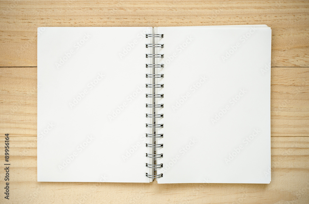 Notebook on wood background. Notebook on wood background.