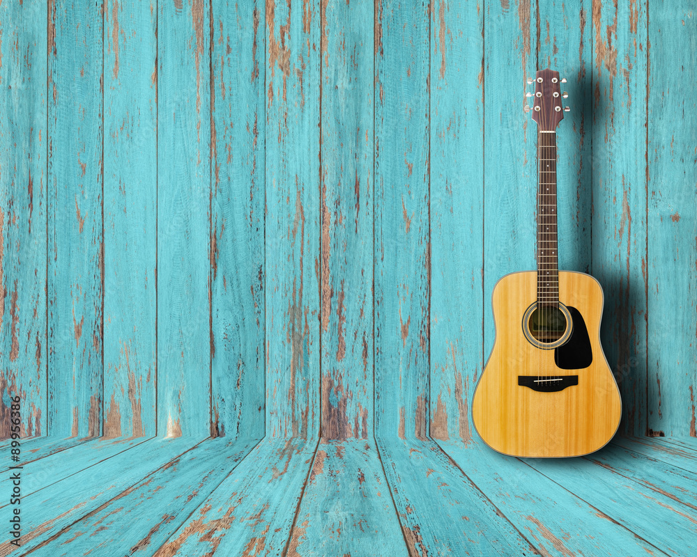 Naklejka premium Gitara w rocznika pokoju drewna.