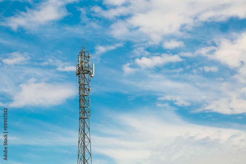 Telecommunication antenna on blue sky with clouds background Telecommunication antenna on blue sky with clouds background