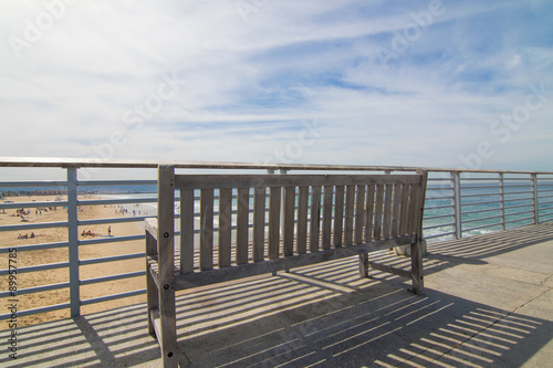 Wood bench on a pier © skye760713