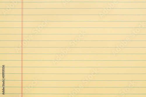 blank yellow notebook page with lines and red margin background