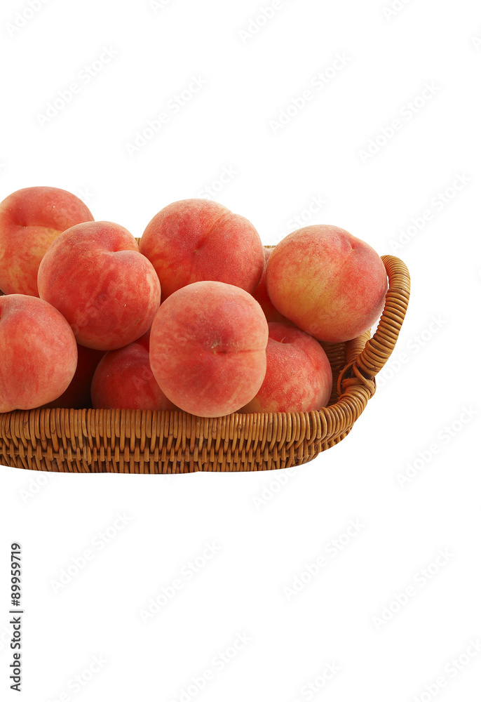 japanese peach in wooden basket on white background japanese peach in wooden basket on white background