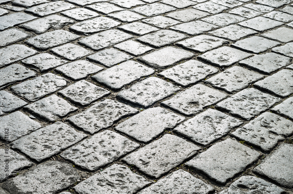 Old road paved with granite stones