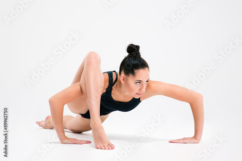 Attractive young girl doing acrobatic stunt
