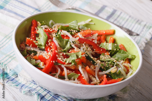 Healthy salad with sprouts, peppers and sesame closeup. horizontal 