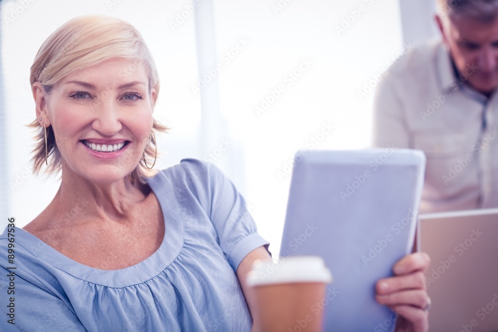 Smiling businesswoman looking at the camera Smiling businesswoman looking at the camera