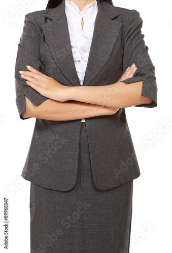 businesswoman standing and folded hands, isolated on white background