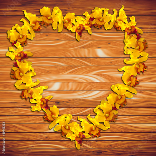 Yellow orchid on wood plank background