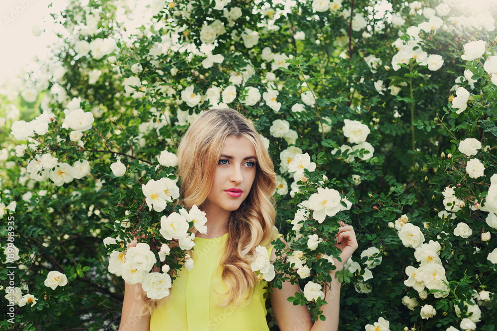 beautiful happy woman with long curly hair smells white roses outdoors, closeup portrait of sensual girl face, blonde female portrait with flowers, elegant lady in blossom garden, vintage toning beautiful happy woman with long curly hair smells white roses outdoors, closeup portrait of sensual girl face, blonde female portrait with flowers, elegant lady in blossom garden, vintage toning