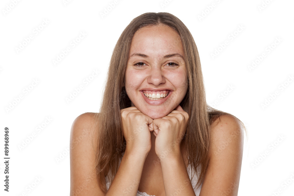 beautiful smiling girl without makeup leaning on her hands beautiful smiling girl without makeup leaning on her hands