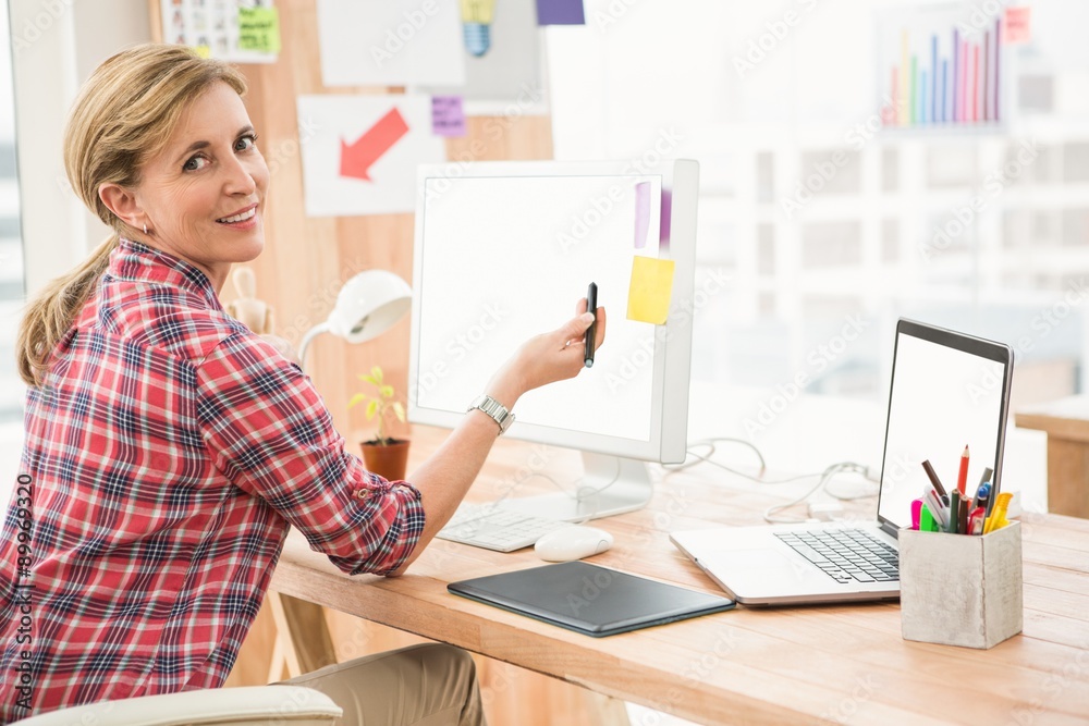 Smiling casual designer working with digitizer Smiling casual designer working with digitizer