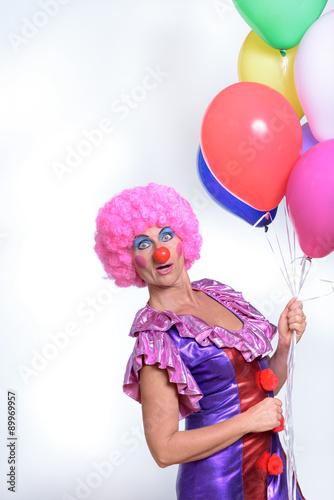 Funny Female Clown Holding Colorful Balloons