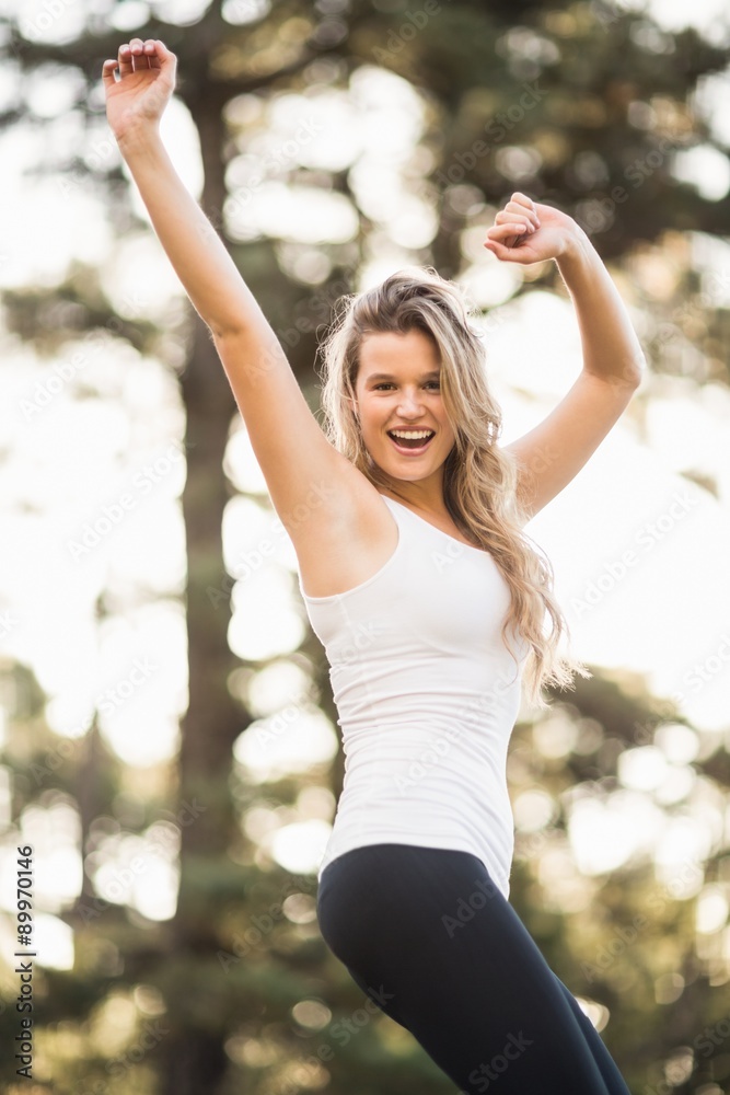 Young happy jogger dancing and looking at the camera Young happy jogger dancing and looking at the camera